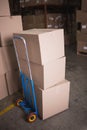 Boxes on trolley in warehouse Royalty Free Stock Photo