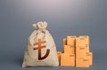 Boxes and turkish lira money bag. The concept of trade in goods and production. Profit from trading. GDP economy. Import export Royalty Free Stock Photo