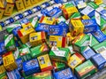 Boxes of various brands of film in a bin at a store including Kodak,FujiFilm, and Konica Royalty Free Stock Photo