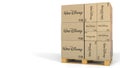 Boxes with Walt Disney logo on warehouse pallet. Editorial 3D rendering