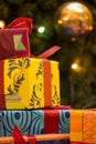 Bright Christmas presents by the Xmas tree