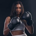 Boxing champion, portrait and woman on black background for sports, strong focus and mma training. Female boxer, gloves