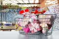 Boxing day. Shopping basket with gifts in supermarket Royalty Free Stock Photo