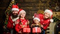 Boxing day. Happy holidays. Father bearded man and mother with cute daughters christmas tree background. Spend time with Royalty Free Stock Photo