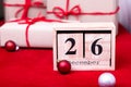 Boxing Day Sale. Calendar with date on red background. Christmas concept. December 26. Christmas ball and gifts