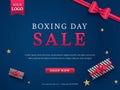 Boxing Day Sale Poster Or Banner Design With Top View Of Realistic Gift Boxes, Golden Stars And Red Bow Ribbon On Blue Royalty Free Stock Photo