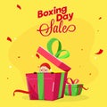 Boxing Day Sale poster design with surprise santa claus in gift box on yellow background