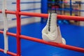 boxing equipment on the ropes of a boxing ring Royalty Free Stock Photo