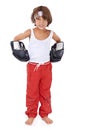 Boxing, fight and angry portrait of child in with courage for martial arts in white background. Challenge, boxer or kid Royalty Free Stock Photo