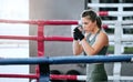 Boxing, fist and athletic woman uses the gym to practice her speed. Focused, powerful and strong lady that is active and