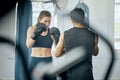 Boxing fitness training with coach at gym, angry woman learning self defense with trainer and learning cardio exercise