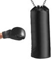 Boxing glove punches punching bag Royalty Free Stock Photo