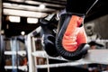 Boxing gloves hanging on ring Royalty Free Stock Photo