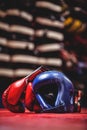 Boxing gloves and headgear in boxing ring Royalty Free Stock Photo