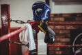 Boxing gloves, headgear and a towel kept on boxing ring