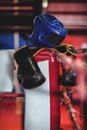 Boxing gloves, headgear and a towel kept on boxing ring Royalty Free Stock Photo