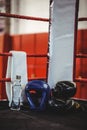 Boxing gloves, headgear, water bottle and a towel in boxing ring Royalty Free Stock Photo