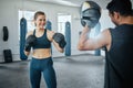 Boxing gym, combat sport and woman training for fight, exercise and workout in fitness club. Happy female, strong Royalty Free Stock Photo