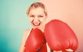 Boxing improve temper and will. Woman boxing gloves focused on attack. Ambitious girl fight boxing gloves. Female rights