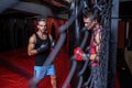 Boxing men training on a pushing ball