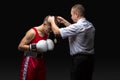 Boxing referee gives medal to young boxer