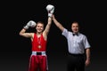 Boxing referee gives medal to young boxer