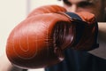 Boxing and sports concept. Athlete with leather box equipment isolated on white background Royalty Free Stock Photo