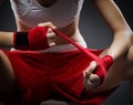 Boxing woman binds the bandage on his hand, before training Royalty Free Stock Photo