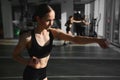 Boxing woman during exercise-gray background at gym Royalty Free Stock Photo