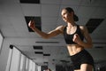 Boxing woman during exercise-gray background at gym Royalty Free Stock Photo