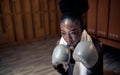 Boxing woman exercise at training, Woman boxer wearing gloves for exercise Royalty Free Stock Photo