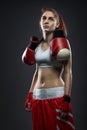 Boxing woman standing in dress boxing , boxing gloves on his shoulder Royalty Free Stock Photo