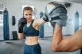 Boxing woman, team training and fitness cardio workout at gym, doing strength exercise with coach and learning female