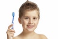 The  boy is actively brushing his teeth. Close-up. Isolated over white background Royalty Free Stock Photo