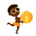 Boy African or African American in summer beach shorts and glasses take the ball in his hands. Royalty Free Stock Photo