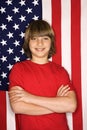 Boy against American flag. Royalty Free Stock Photo