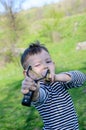 Boy Aiming Sling Shot at Camera Royalty Free Stock Photo