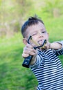 Boy Aiming Sling Shot at Camera Royalty Free Stock Photo