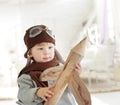 Boy with airplane in hand Royalty Free Stock Photo