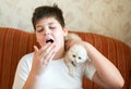 The boy is allergic to cat Royalty Free Stock Photo