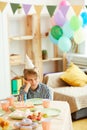 Boy Alone at Birthday Party Royalty Free Stock Photo