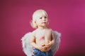 Boy with angel wings and kisses on his body Royalty Free Stock Photo