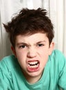 Boy in anger rage emotional closeup portrait