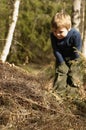 Boy and ant-hill Royalty Free Stock Photo