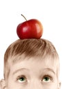 Boy with an apple on his head