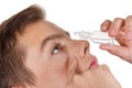 Boy applying eye drop Royalty Free Stock Photo