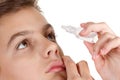 Boy applying eye drop Royalty Free Stock Photo