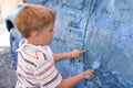 Boy artistically paint car Royalty Free Stock Photo