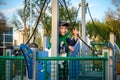 Boy as a captain or sailors play on the ship outdoors on sunny day. Kid has a lot of fun. Ship has colorful flags on wind Royalty Free Stock Photo