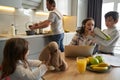 Boy asking advice about homework from his working mother Royalty Free Stock Photo